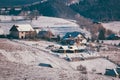 Ancient romanian houses on the frozen hills in the middle of winter