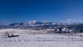 Ancient romanian houses on the frozen hills in the middle of winter