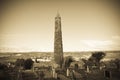 Ancient round tower and celtic graveyard with cathedral