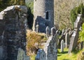 The ancient round tower in the cemetery at the historic Glendalough Monastic Site in County Wicklow in Ireland