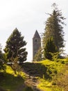 The ancient round tower in the cemetery at the historic Glendalough Monastic Site in County Wicklow in Ireland Royalty Free Stock Photo