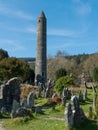 The ancient round tower in the cemetery at the historic Glendalough Monastic Site in County Wicklow in Ireland Royalty Free Stock Photo