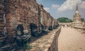 Ancient ruin of sitting buddha statue at old royal temple.