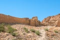 An ancient ruined stone wall in desert Royalty Free Stock Photo
