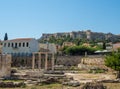 Ancient ruins of buildings and the remains of a colonnade in the Roman Agora with the Acropolis in the background in Athens, Royalty Free Stock Photo