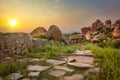 Ancient ruins in Hampi on sunset. India