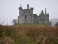 Ancient ruins of the Kilchurn Castle in a gloomy weather Royalty Free Stock Photo