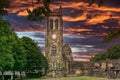 The Old Clock Tower Ruins at KIlwinning Abbey at the end of the day in front of a dramatic red Sky Royalty Free Stock Photo