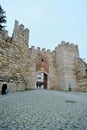 Ancient ruins of ottoman walls in Bursa during overcast and rainy day.