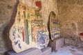 Part of the colored brick wall with painted frescoes in Pompeii, Naples, Italy. The ruins of the ancient city, excavations of Pomp Royalty Free Stock Photo