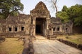 Ancient ruins of Preah Khan temple in Angkor Wat, Cambodia. Decorated entrance with stone bas-relief. Stone temple ruin. Royalty Free Stock Photo