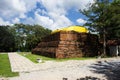 Ancient ruins stupa chedi on mountain hill and antique stone bell of Wat Khao Phra Si Sanphet Chayaram temple for thai people