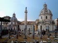 Ancient ruins of the Trajan`s forum in Rome, Italy. Imperial forum traiani and Santa Maria di Loreto Church. Ancient roman ruins Royalty Free Stock Photo