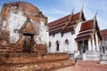 Ancient ruins ubosot ordination hall and antique old ruin stupa chedi for thai people visit respect praying blessing at Wat Yai