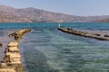 Ancient ruins of windmill and port in Elounda town, Crete island, Greece Royalty Free Stock Photo