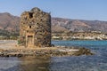 Ancient ruins of windmill and port in Elounda town, Crete island, Greece Royalty Free Stock Photo