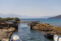 Ancient ruins of windmill and port in Elounda town, Crete island, Greece Royalty Free Stock Photo