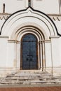 Ancient russian architecture. Close-up of arched metal door in russian style Royalty Free Stock Photo