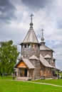 Ancient Russian wooden church under stormy sky Royalty Free Stock Photo