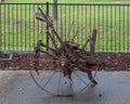 Ancient rusted farm equipment in 1939 Farmall F20 Tractor exhibit in Frisco, Texas.