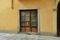 Ancient rustic woodden closed portal on yellow wall