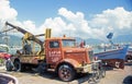 Old rusty car Bussing truck with crane in Alanya harbor