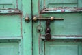 Ancient rusty door latch with padlock