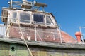 Ancient Rusty Ship Board of old and colored boat wooden hull past used painting with cracks and wood texture