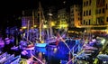 Ancient sailing ships and festive illuminations in port Camogli