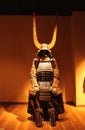 Ancient samurai warrior harness in dramatic light with huge horn helmet in a museum in Tokyo