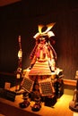 Ancient samurai warrior harness in dramatic light with mustache and bow and arrows in a museum in Tokyo