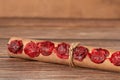 Ancient scroll with seven seals on wooden table, a closeup