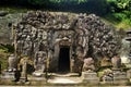 Ancient sculpture carving gate entrance tunnel of Goa Gajah or Elephant Cave significant Hindu archaeological site for travelers Royalty Free Stock Photo