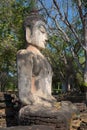 Ancient sculpture of a seated Buddha at the ruins of the Buddhist temple Wat Phra Kaeo. Thailand Royalty Free Stock Photo