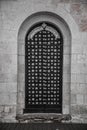 Ancient semicircular door to the church. Old architecture. Stone wall. Royalty Free Stock Photo