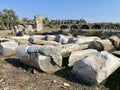 Ancient Side, Turkey, columns on the ground, buildings behind. Royalty Free Stock Photo