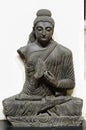 An ancient sitting Buddha& x27;s idol kept in a museum