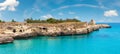 Ancient small caves on picturesque Adriatic sea coast Archaeological Area of Roca Vecchia, Salento, Puglia, Italy