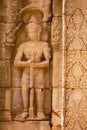 Ancient soldier bas-relief on a wall at Banteay Kdei temple ruins, in Angkor Wat complex near Siem Reap, Cambodia.