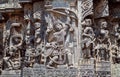 Ancient soldier with bow and arrow on the Hindu temple walls. 12th centur Hoysaleshwara temple in Halebidu, India.