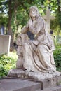 Ancient sorrow woman tombstone statue
