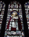 Ancient stained glass window dedicated to saint edward the confessor the saxon king in the medieval cartmel priory in cumbria