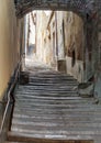 Ancient staircase with an arch in the center of Cortona Royalty Free Stock Photo
