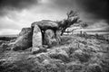 Ancient standing stones under brooding skies.