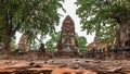 Ancient Statue of Buddha and Archaeological site at Wat Mahathat Ayutthaya Historical Park, Thailand. UNESCO world heritage Royalty Free Stock Photo