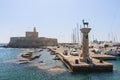 Ancient statue of a deer and a medieval lighthouse Rhodes