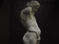 Ancient statue of Priapus symbol of the fertility of ancient Rome isolated on blACk Royalty Free Stock Photo