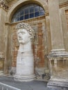 Ancient statue of Roman emperor, walls of ancient building in Vatican religious and tourist city Royalty Free Stock Photo