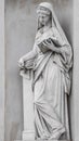 Ancient statue of sensual Italian Renaissance Era woman reading a book, Potsdam, Germany, details, closeup