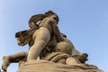 The ancient statue of the Three cherubs (winged angle cupids) playing on a column Royalty Free Stock Photo